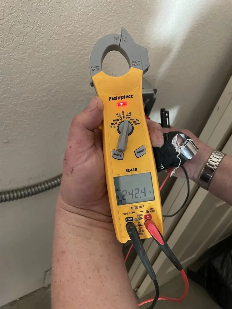 Voltage testing with clamp meter during Electrical Installation Services in Kawkawlin